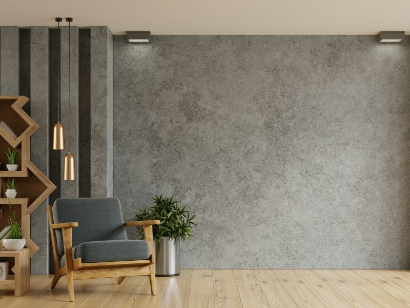 Living room interior style loft with armchair on empty concrete wall